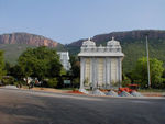 Tirumala (the temple town at the top of the hills) is known as the abode of the Hindu god Venkateshvara, Lord of Seven Hills. The Tirumala Hills are considered so sacred that before 1870 non-Hindus were not permitted to ascend them. This photo is taken near the beginning of the footpath to the temple complex.  Most of the 50,000 + pilgrims who visit every day take a bus or drive but a fair number walk.  Many parts of Tirupathi and all of Tirumala and the Tirumala Hills are run by or landscaped by the efficient temple authorities (TTD).  Many median strips are landscaped by the TTD's Forest Department.  The streets leading to the footpath and up to the temple are clean.  In fact, the TTD asks people not to smoke in the hills.
