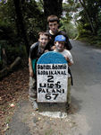 Three monkeys and a mile marker