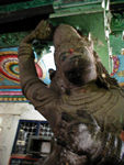 Duncan says this is Hanuman.  In Hindu mythology, Hanuman was the divine monkey chief, a central figure in the great Hindu epic the Ramayana ("Romance of Rama"). Accompanied by a host of monkeys, he aided Rama in recovering his wife, Sita, from the demon Ravana. He also acted as Rama's spy in the midst of the demon's kingdom; when he was discovered and his tail set on fire, he burnt down their city, Lanka. Hanuman flew to the Himalayas and carried back the mountain of medicinal herbs to restore the wounded among Rama's army. He crossed the strait between India and Sri Lanka in one leap.  In his devotion to Rama, Hanuman is upheld as a model for human devotion to god.