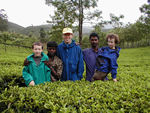 In a tea field with our jeep driver and "car boy"