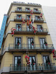 Santas climbing building