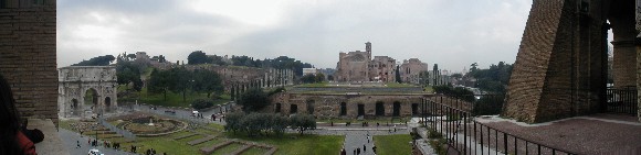 View of the Forum from the Colosseum. On the left is the Arch of Constantine, made from pieces and parts of old art with the heads replaced. Then Palatine Hill and the entrance to the Forum with the Arch of Titus.