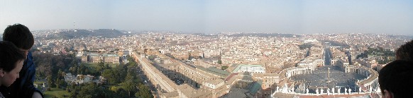 View of the Vatican Museum, Sistine Chapel, Pope's apartments, St. Peter's Square, and the front of St. Peter's from  St. Peter's Dome.  Straight out of the Square runs Via Reconciliation.  On the left near the end of the Via is the Castel with the Bridge of Angels in front of it.