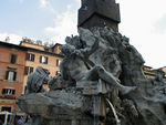 Bernini fountain to four rivers in  Piazza Navonna.  The figure in the background is the Nile.  Its head is covered, because its headwaters were unknown.   