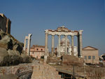 The eight columns are what remains of the Temple of Saturn.  The Romans kept the state treasury here.