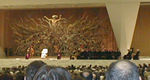 The Pope at the weekly audience in the papal auditorium.  On the right are a collection of church people, mostly bishops, and a few laymen.  One of the bishops would walk to a microphone and announce to the Pope that the English-speaking (or Spanish-speaking, or Italian-speaking, etc.) visitors gave him greetings, announce the groups that were there (who often sang a little song - the Texans had a loud obnoxious cheer), told the people that the Pope would bless them and any religious articles at the end of his greeting, and then sat down.  The Pope then read a brief sermon and greeting in whatever language was being used.  The Pope handled Polish on his own.  It was friendly but formal, and I can imagine that medieval audiences with a monarch followed a similar pattern.  (The modern backdrop, depicting the risen or rising Christ is strangely similar to Boticcelli's Birth of Venus and is incredibly ugly.)