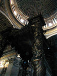The dome and Bernini's seven story altar canopy.  It was made from bronze removed by one of the Barberini popes from the Pantheon in the 17th Century.  To that point, the Pantheon, constructed in its current form in AD 125 , had survived until then largely intact.  The pope's depredation led Roman's to remark, "What the barbarians didn't do, the Barberini's did."  The canopies pillars are modeled after those of Solomon's Temple.  According to one of our guidebooks, the actual columns looted from Solomon's Temple are now part of the four balconies that overlook the canopy.