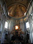 The altar with Bernini's altarpiece complete with "Throne of Peter," supposedly an oak chair built for a king in medieval times, statues of four church fathers (two western and two eastern), cherubs and lots of gold clouds.  The stained glass window with the dove is the only stained glass window in St. Peter's.  