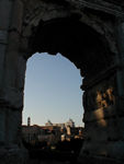 Looking through the Arch of Titus across the Forum and over to the twin top of the Victor Emmanuel Monument
