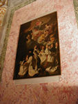 A painting in St. Barbara's showing the Virgin, various saints, and the bookseller who paid for the painting.  