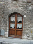 This is an example of the lovely doorways with lace curtains that we saw in many places in Gubbio