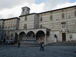 The cathedral of San Lorenzo (1345-1430), home of the supposed white onyx espousal ring of the Virgin.  In front of the cathedral is the Maggiore Fountain by Fra Bevignate from 1278.  In the foreground is Piazza Quattro Novembre .