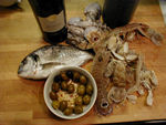 Monica's favorite sort of art.  A still life you can eat.  Wine, fresh seafood, and olives.  