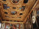 The Collegio.  The doge received ambassadors here, and it's where the Pien Collegio met to prepare bills to send to the Senate.  The paintings are by Paolo Veronese.  It's hard to tell from the photo, but that's a 24-hour clock on the wall.   The painting just "below" the black oval shows Venice enthroned receiving a sword from Justice and an olive branc from Peace.