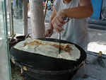 Our lunch being cooked.  We don't know what it was, but a good name would be a "Beijing Crepe."
