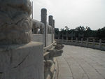 South of the Vault's enclosure is the Circular Mound Altar, built in 1530 and rebuilt in 1749. The triple-tiered white stone terrace is enclosed by two sets of walls that are square outside and round inside; thus, the whole structure forms an elaborate and integrated geometric pattern. The top terrace is paved with nine rings of stones.  To Mark's delight, which everyone else endured, he and Tote discovered that the number of paving stones in each ring is a multiple of nine.