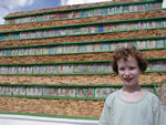 Maggie with 1000 buddhas at the bottom of Changpo Ri.  Changpo Ri is a hill in the middle of Lhasa with lots of devotional things and a steel telecom tower on it.
