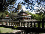 This is part of the Summer Palace of the Dalai Lamas.  It's a nice place but is most interesting because this is where the current Dalai Lama was living before his escape to India.  In 1959, after the Chinese seemed about to take the Dalai Lama prisoner, 30,000 Tibetans surrounded the palace determined to prevent the Dalai Lama from falling into Chinese hands.  In the popular uprising that followed the Dalai Lama's escape, the Chinese shelled most of these buildings.  