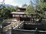 This is the retreat of the 13th Dalai Lama.  The 14th Dalai Lama's palace was the most interesting, featuring modern plumbing and a Hi Fi, as well as two marvelous murals.  One mural depicts the history of the Tibetan people from the union of the ogress and the monkey.  The other shows the history of the Dalai Lamas and shows the current Dalai Lama as a young fellow surrounded by his friends.