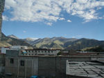Looking out the Flora's window to the green hills above Lhasa.
