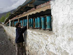 Prayer wheels, some made from milk tins