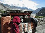 Monk and Tote with the wind-powered prayer wheels