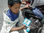 In the middle of nowhere, we ran across this kid killing time with a handheld video game.