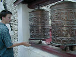 Spinning prayer wheels at the monastery.