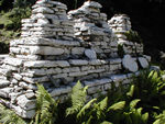 We don't know what these things are called, but they are cairns with carved stone tablets placed on them.  