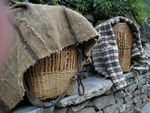 Porters baskets.  The porters cart incredibly heavy things up and down the path.  In the north, were there are few trees, they cart wooden beams.  In the south, they haul bags of rice.  Everywhere, they haul nearly everything imaginable.  They carry their loads with a strap strung over their heads and the load resting on their backs.