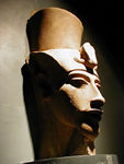 Akhenaton, carved in an odd, caricature-like way that appeared in art during his reign.