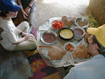 Our favorite meal on the whole trip: three loaves of traditional bread (there was a small mud oven outside - the family has a small wheat field and a mud and straw granary that looked as if it would hold less than 50 gallons.  There's a mill in town to make flour), two bowls of fool (bean stew), tomatoes and salt, roasted sesame seeds, pickled vegetables, and an omelet.
