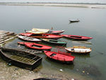 More boats, painted with advertisements, on the Ganges.