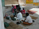 Barber on the ghat.  Pilgrims sometimes have their heads shaved.