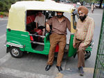 New CNG autorickshaw.  The CNG rickshaws are green or have a green stripe.  