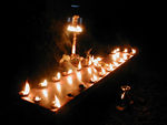 Along the path of the procession, people set out flames and lamps
