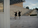 These fellows, who look like they are dancing or imitating the mating dance of storks, are marching around Greece's tomb of the unknown soldier in front of the Parliament. 