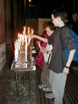 Lighting candles in Santa Maria in Cosmedin