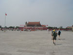 Crossing Tiananmen Square - yes, the place where the pro-democracy demonstrators hung out and were killed in 1989.  Tiananmen occupies more than a hundred acres, making it one of the biggest public squares in the world.  This is looking north toward Tiananmen Gate and the entrance to the Forbidden City.  We have already traversed about two thirds of this ghastly, bleak, and hot space.