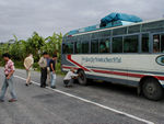 The bus to Kathmandu with a flat tire.