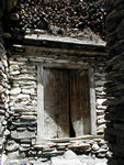 Door.  You can see the firewood stacked on the roof.