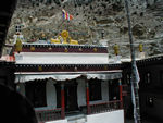 Front of the temple building with the dharma wheel and deer symbol that represents Buddha preaching to the animals