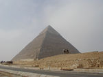 The "middle" pyramid, that of Khafra.  The apex of the pyramid still has its original limestone coating.  