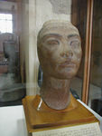 Queen Neferati.  Wife of Akhenaton (who established a new monotheistic cult of Aton which was then undone by King Tut) and mother of six daughters.  The bust is unfinished and still bears the artist's markings.  