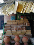 Shop selling cloth and incense.  Sometimes incense is sprinkled on the fire
