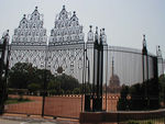 Looking through the gates at the President's house.   This is considered Lutyens most important building.  It combines western and Indian themes.  Unfortunately, it's rather hard to get a look at.  Hidden behind these big gates and protected by guards who kept chasing us from one spot to another, the house has 340 rooms.