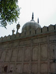 Moti Masjid, a mosque built in 1659 by Aurangzeb, who deposed Shah Jahan.  The walls enclosing the mosque are aligned with the rest of the Red Fort, but the mosque inside is aligned with Mecca.  Even behind its walls, the mosque has an unusual grace.  Next to the mosque were the royal baths.  All through the grounds, water ran through channels.  It even ran through the royal apartments.