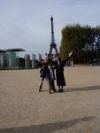 Eiffel Tower and peace monument and three strange people